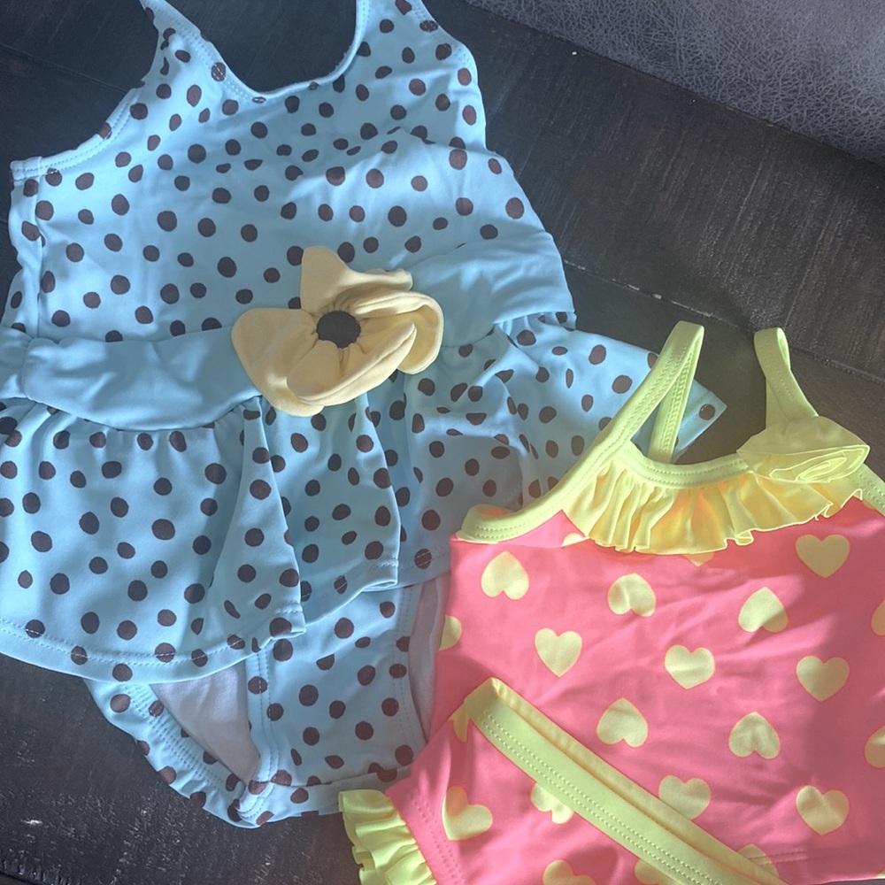 2 baby swimsuits size 3-6m & 6-12m